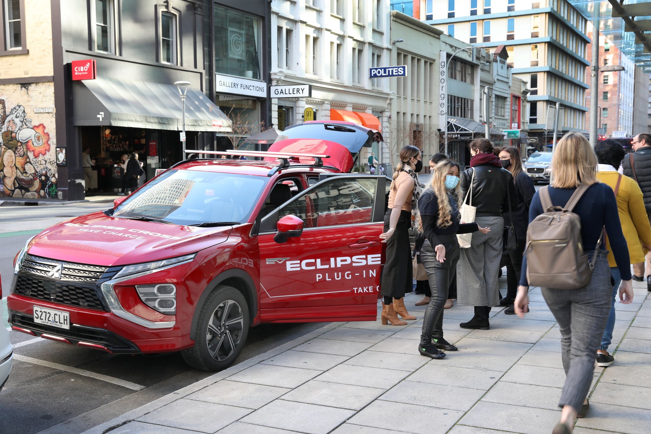 2023 Mitsubishi Eclipse Cross PHEV providing coffee