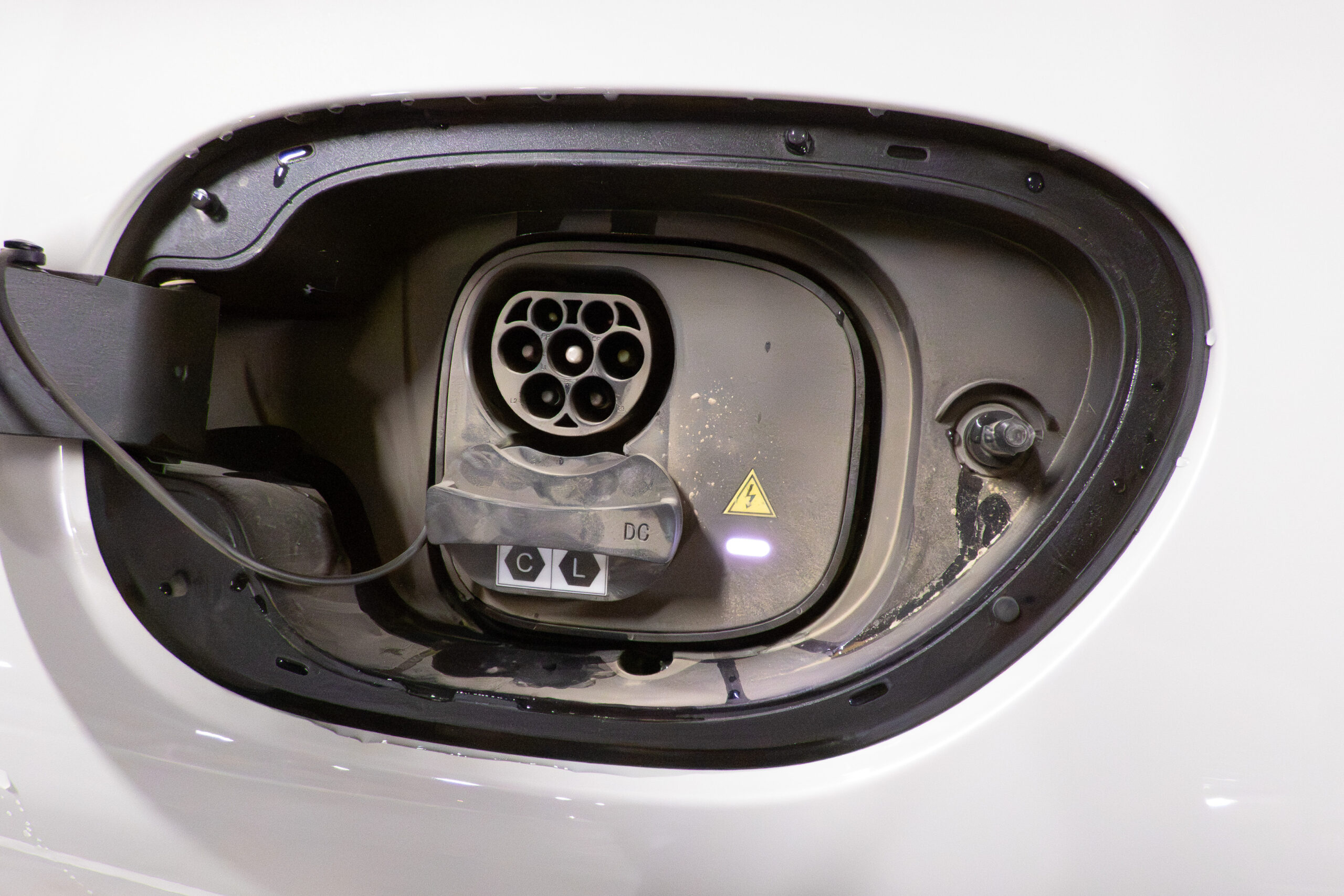 Close-up of the electric charging port door open on the IM5 Performance 2025