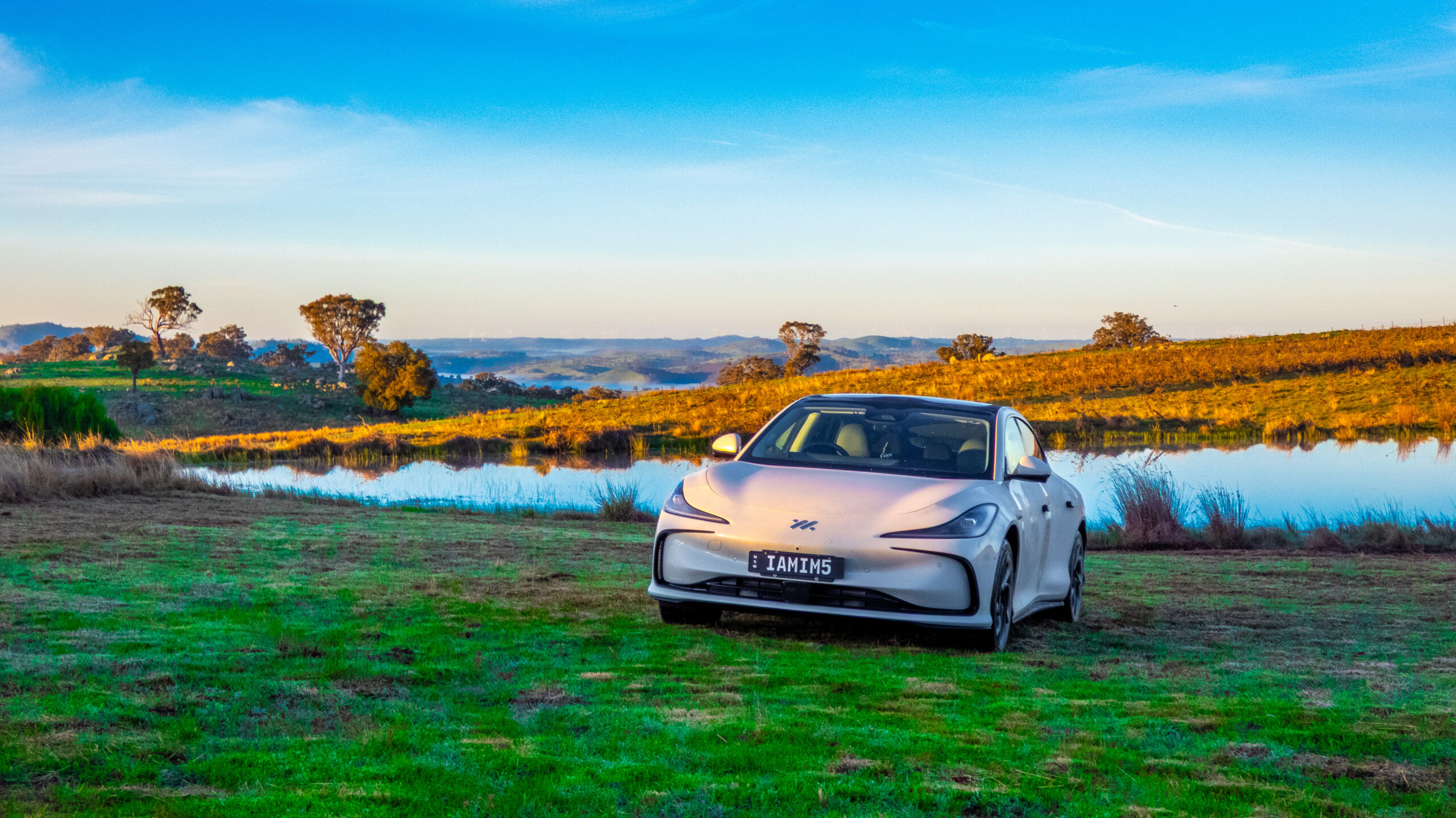 IM5 Performance 2025 driving on a dirt road in an off-road setting