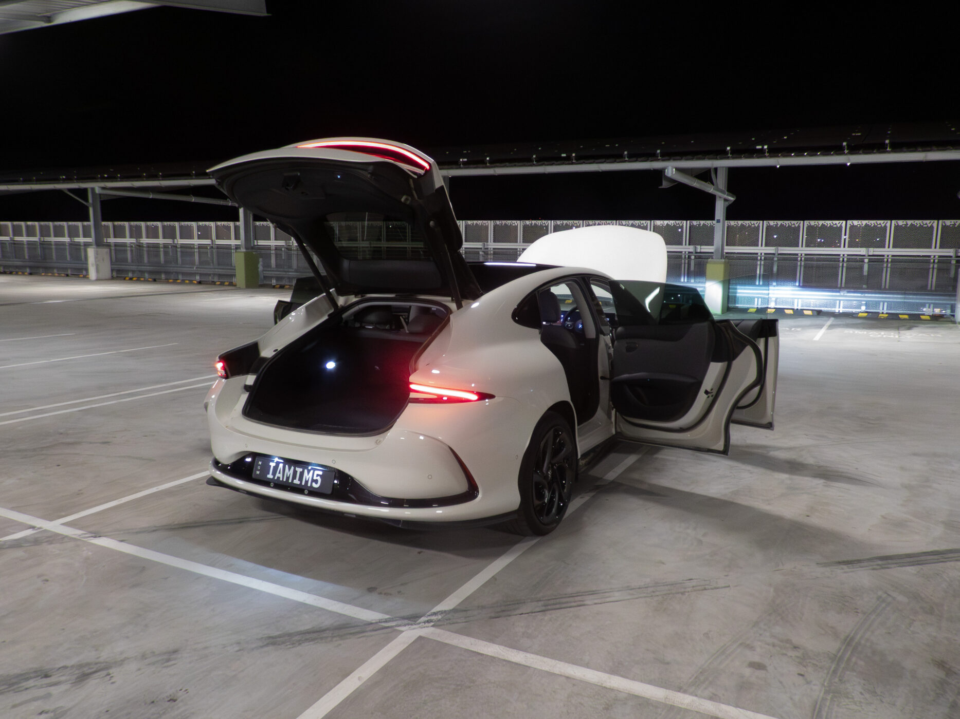 Rear view of the IM5 Performance 2025 with the boot and rear doors open