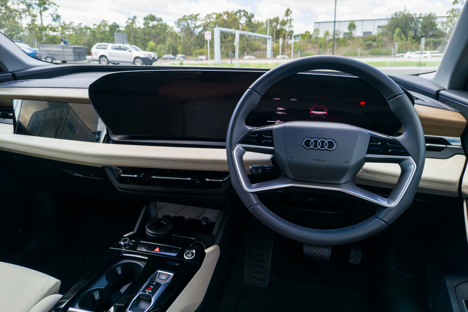 Driver’s perspective of the Audi Q6 e-tron digital stage and panoramic curved display.