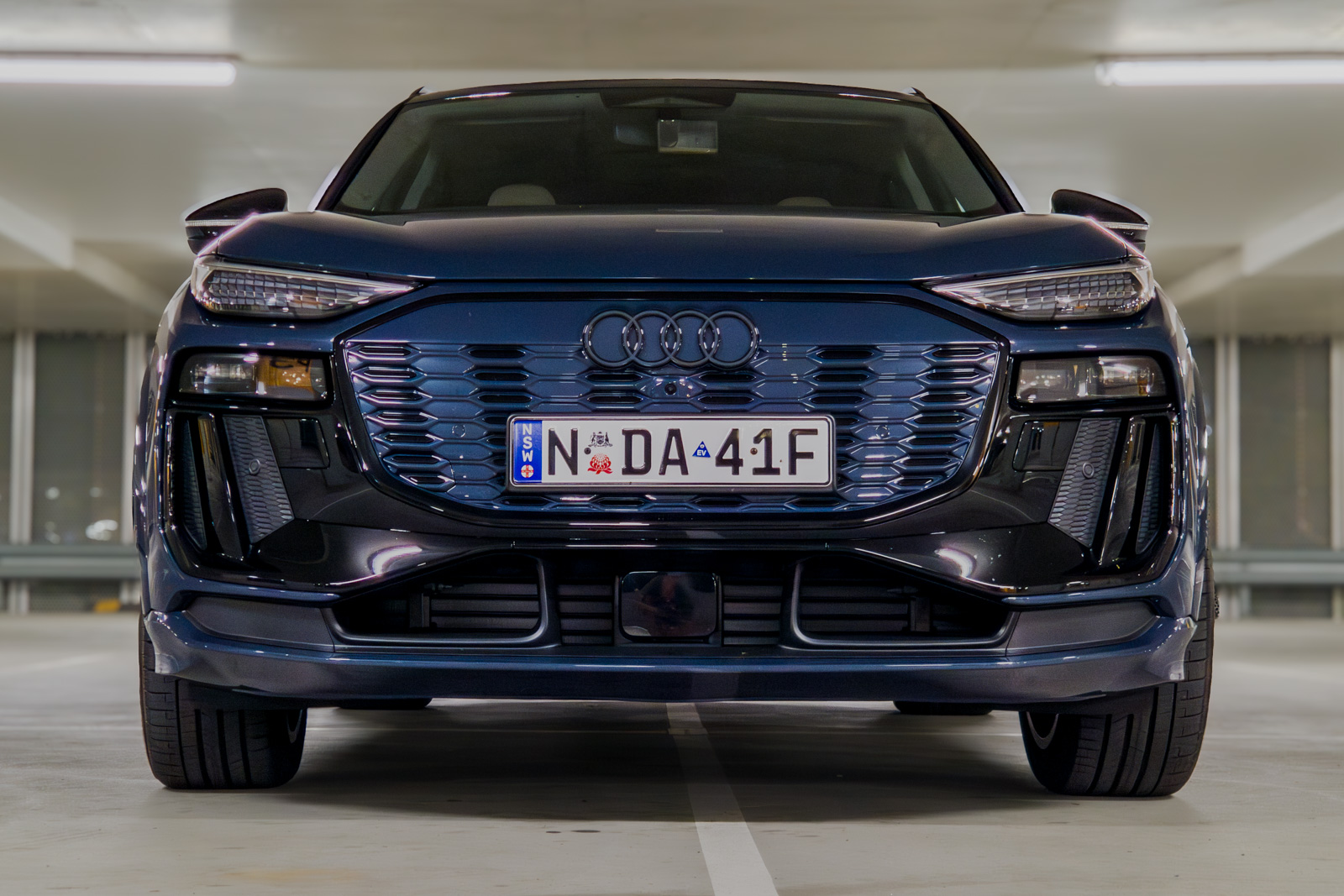 Ground clearance view of the front of the Audi Q6 e-tron electric SUV.