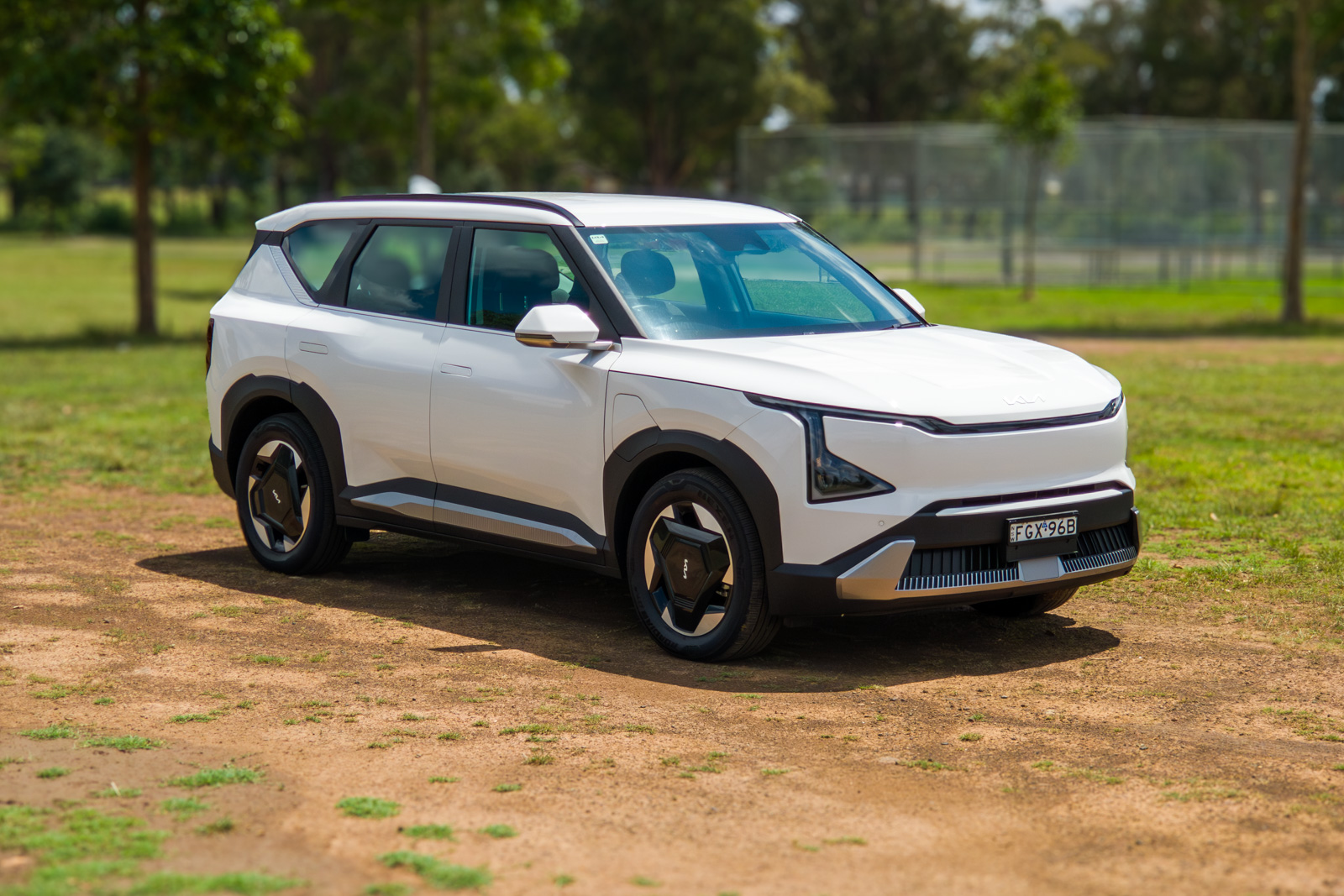 Full driver-side profile of the Kia EV5 electric SUV highlighting its boxy silhouette.