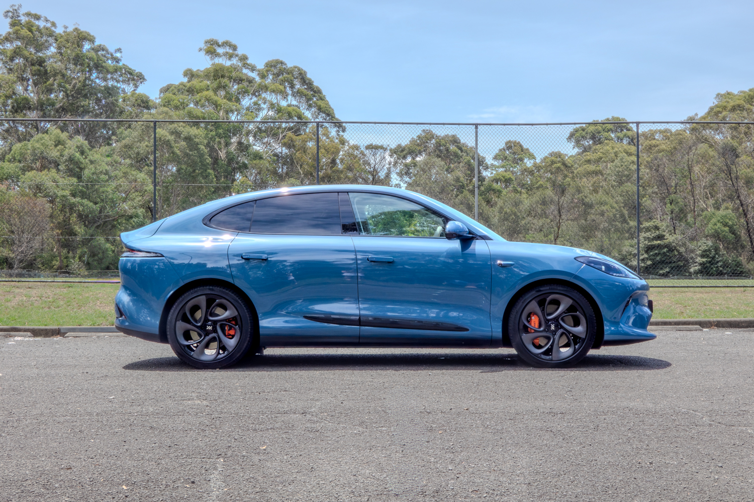 Side profile of the 2025 MG IM6 Performance electric SUV highlighting its sleek coupe-like design.