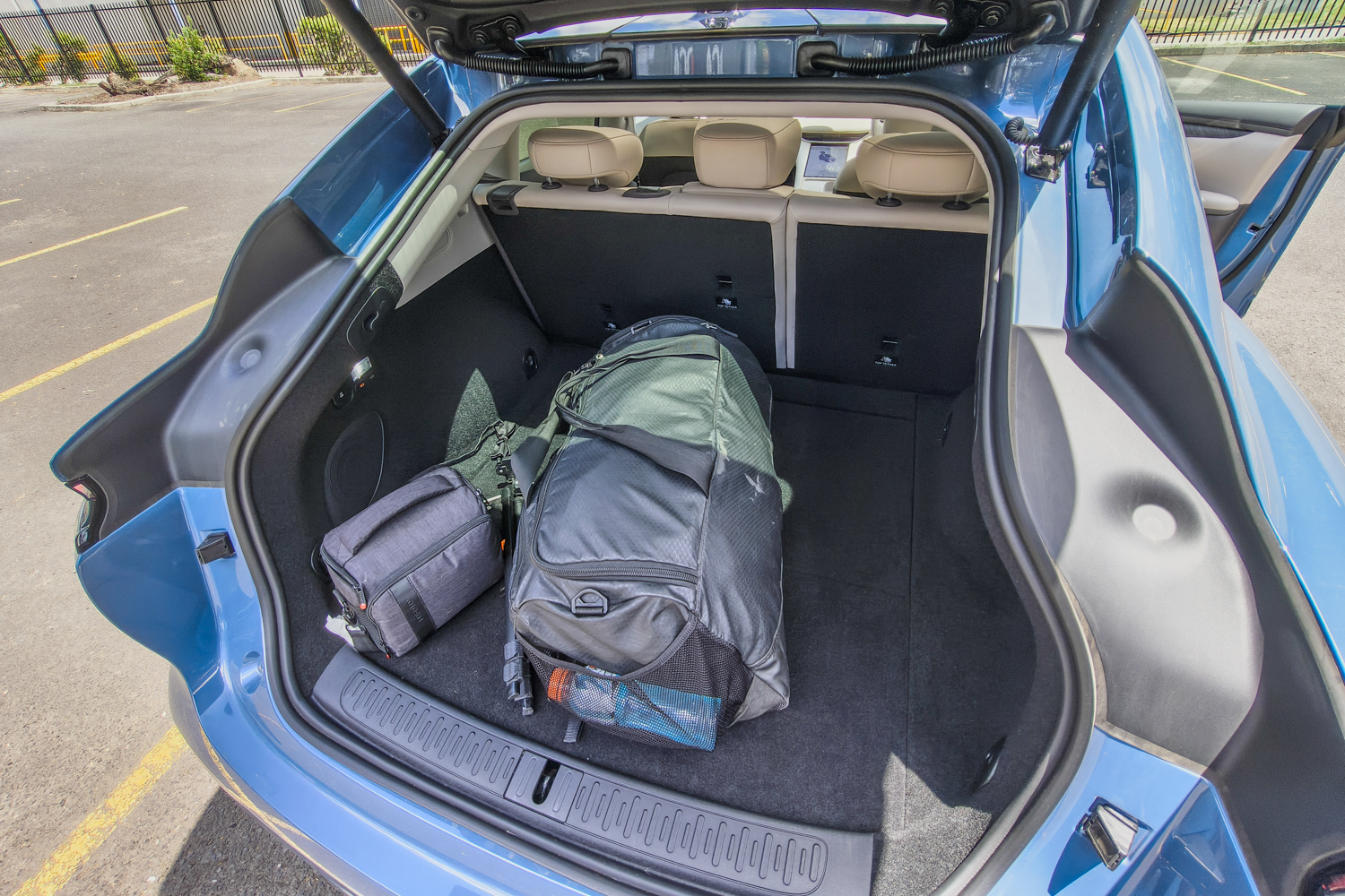 Open boot of the 2025 MG IM6 Performance showing 646 litres of cargo space and flat-folding rear seats.