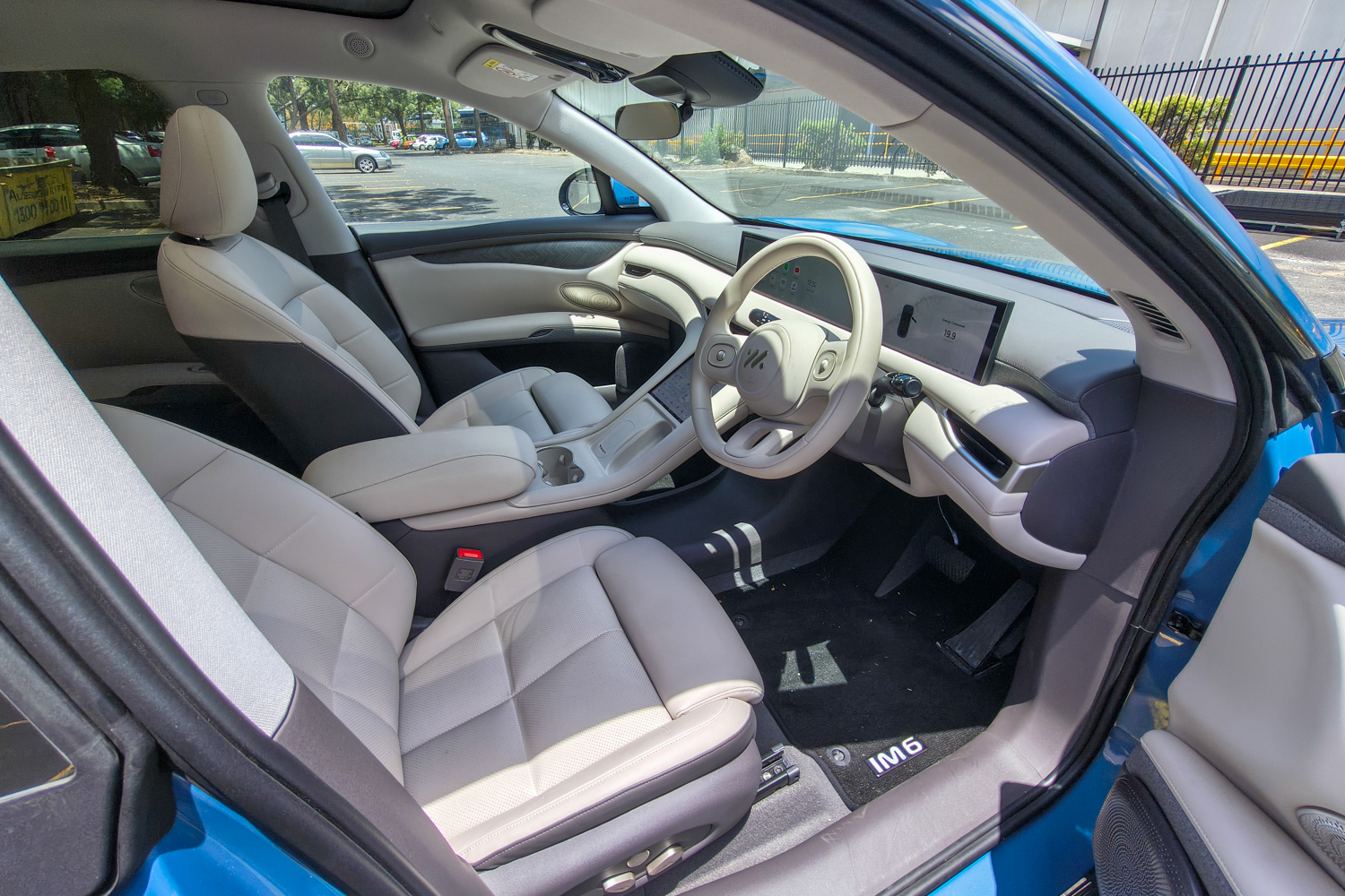 Front door panel of the IM6 Performance showing premium materials and integrated speaker design.