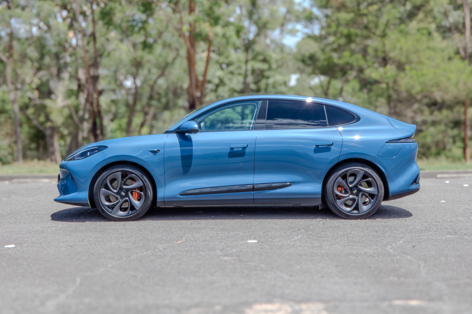 Full passenger side view of the IM6 Performance 2025 electric SUV with flush door handles.