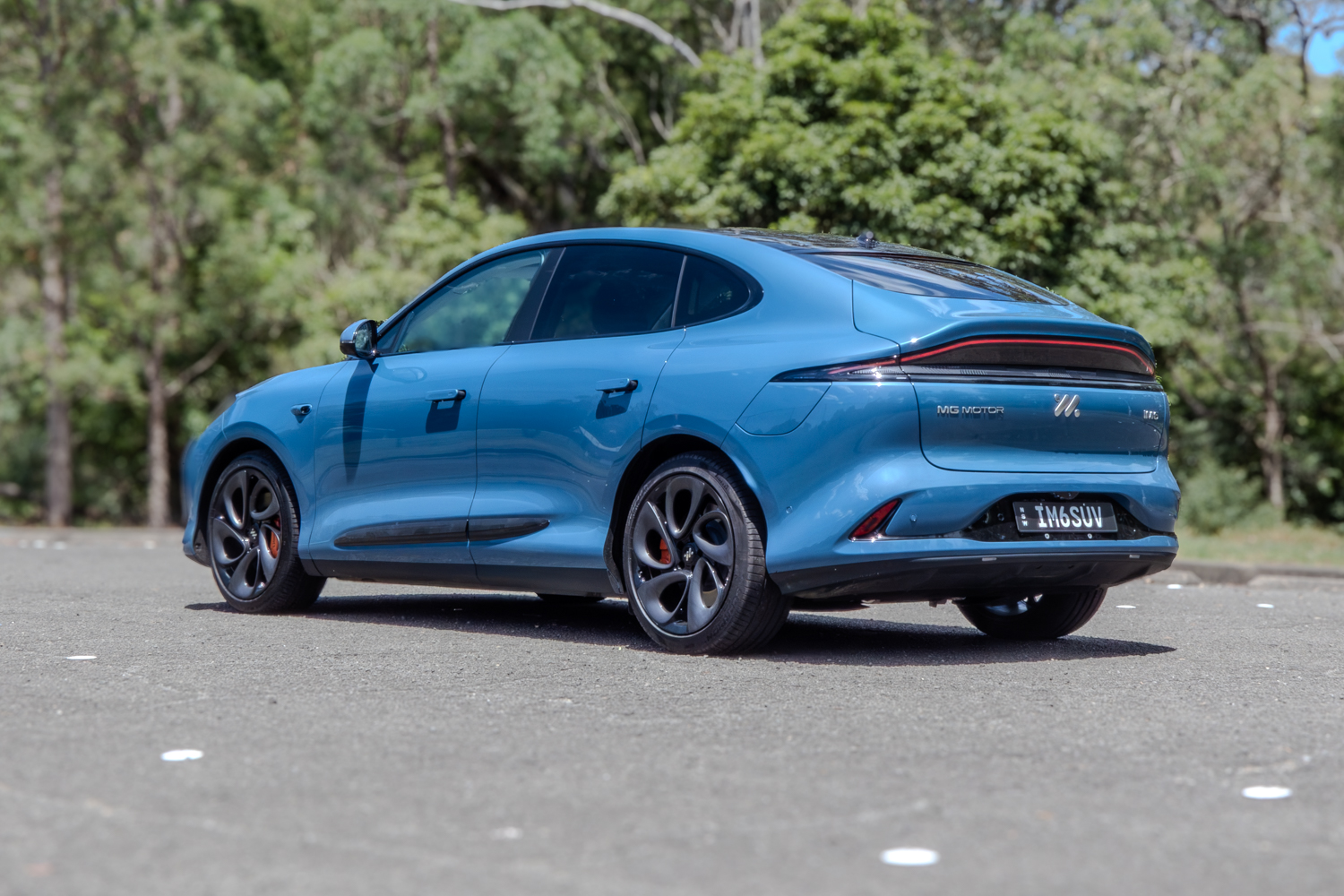 Three-quarter rear passenger view of the MG IM6 2025 Performance luxury EV.