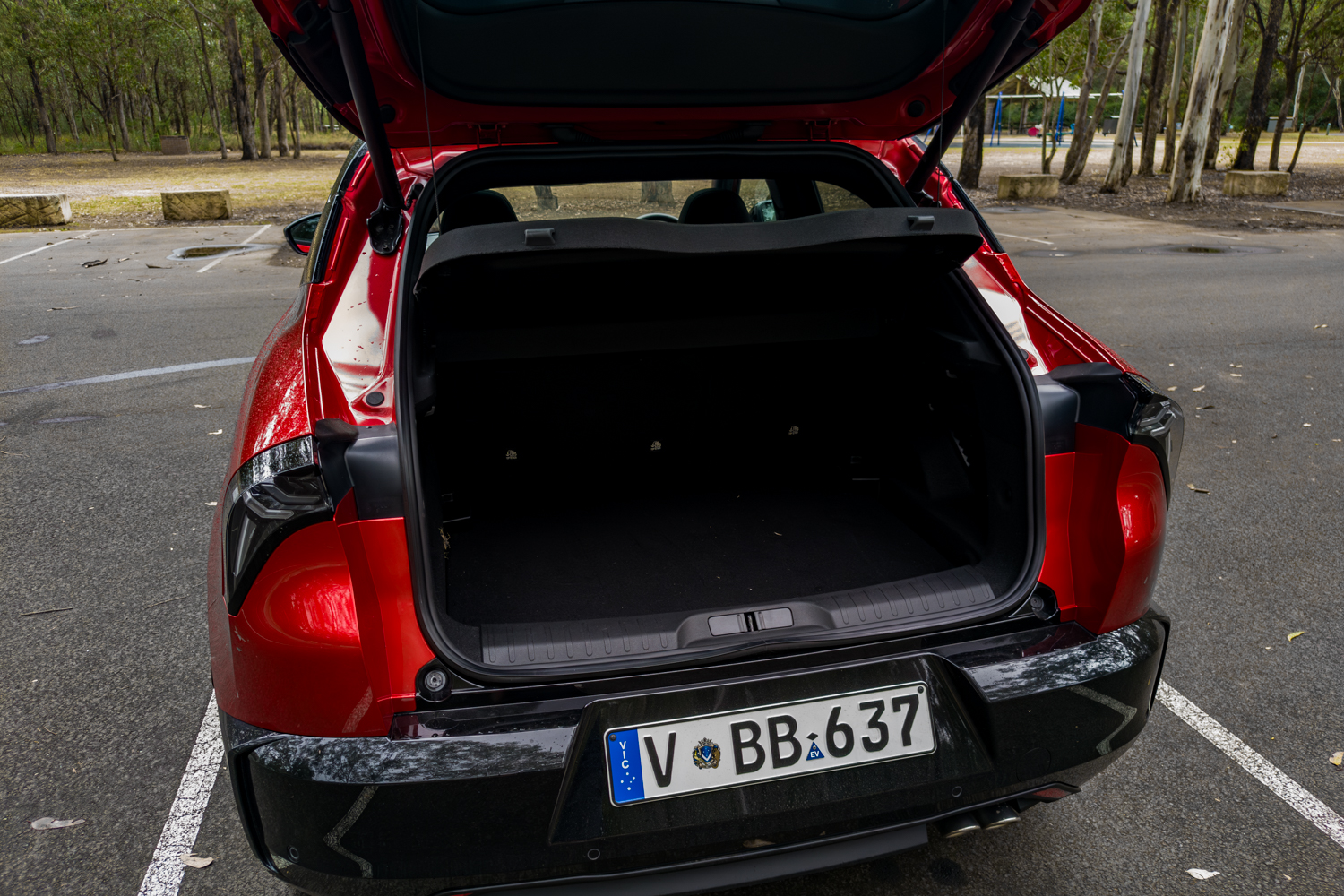 Tailgate raised showing the flat-loading floor and 415-litre cargo space