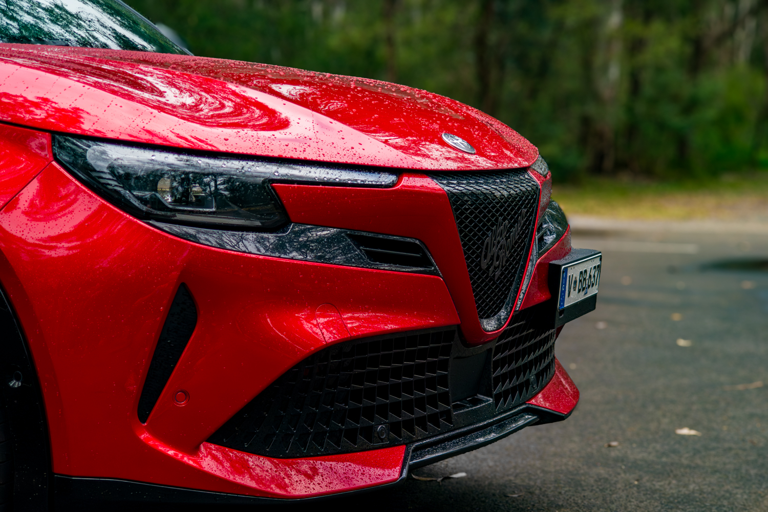 Triangular scudetto grille and split LED headlight close-up on the Junior Ibrida