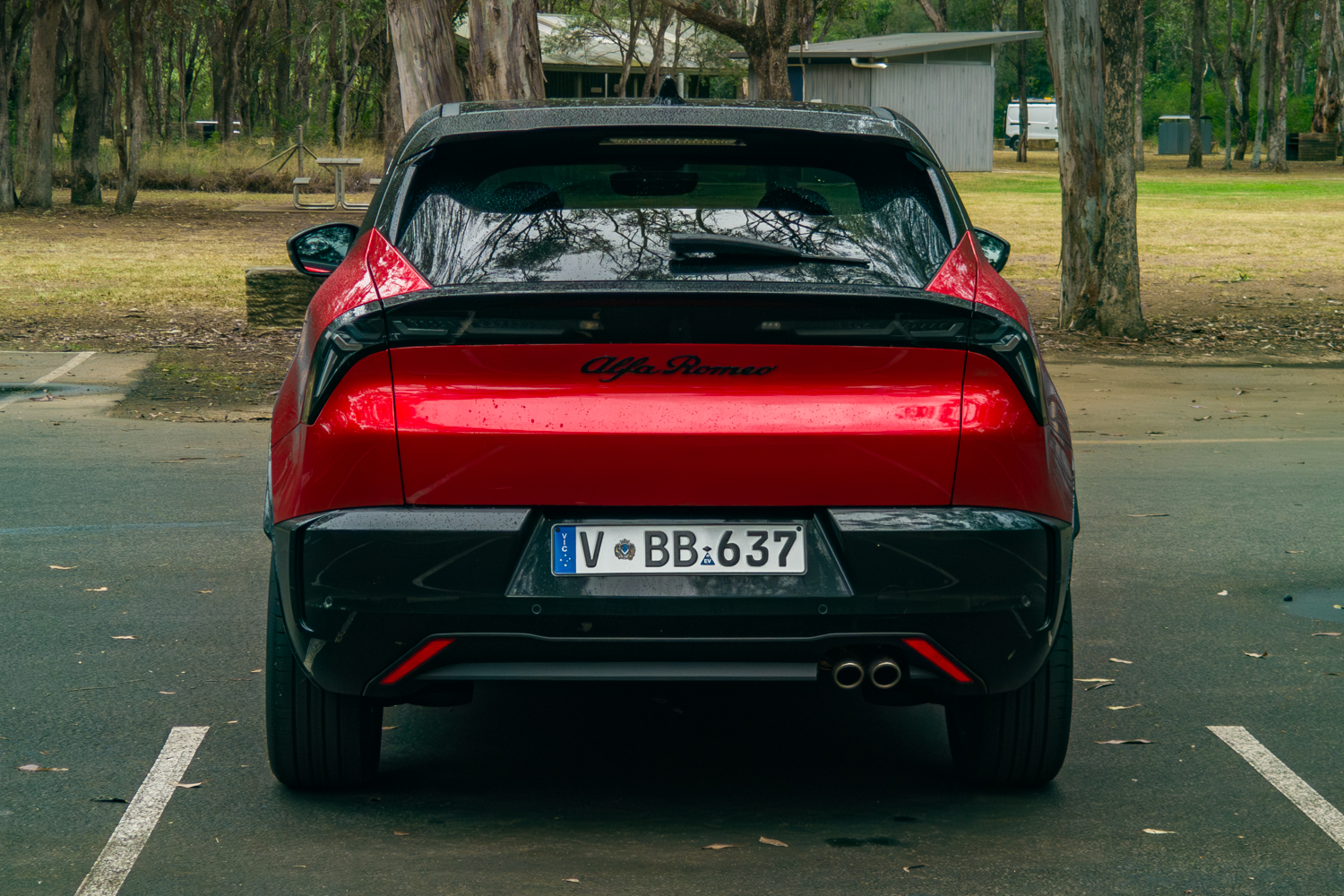 Rear view highlighting the spanning LED light bar and twin exhaust outlets