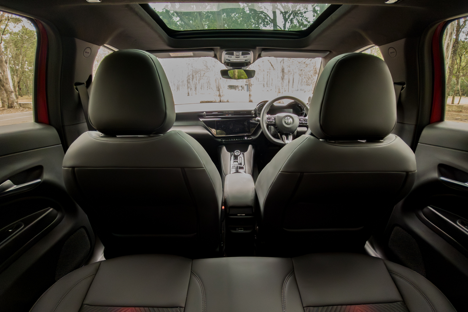 Rear bench and panoramic roof viewed from behind the front headrests