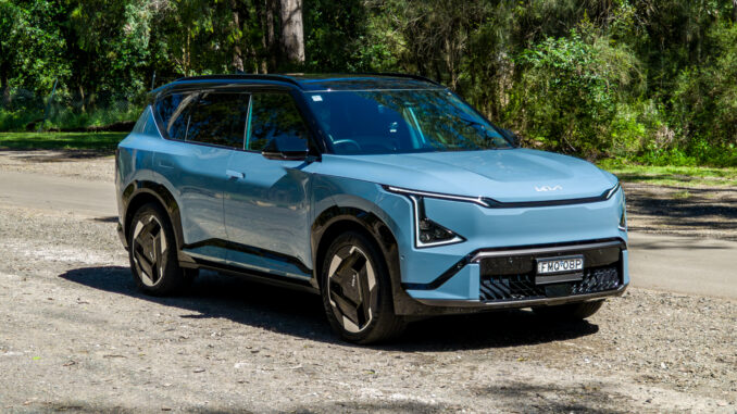 Front three-quarter view of the blue Kia EV5 GT-Line electric SUV from the driver's side