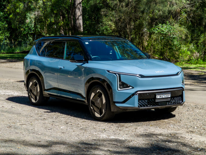 Front three-quarter view of the blue Kia EV5 GT-Line electric SUV from the driver's side
