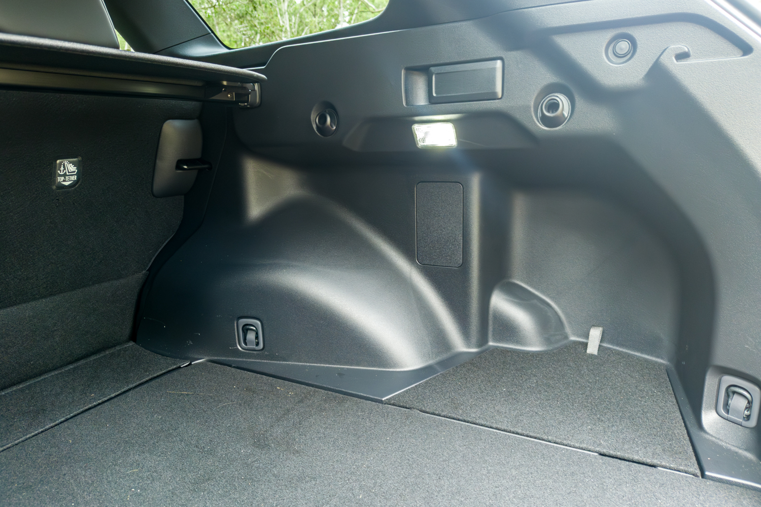 2026 Subaru Trailseeker electric SUV, boot side panel with tie-down hooks and tether
