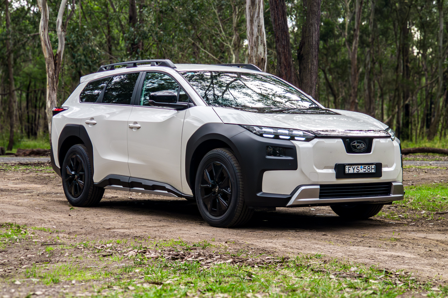 White 2026 Subaru Trailseeker electric SUV, front three-quarter driver side, in bushland