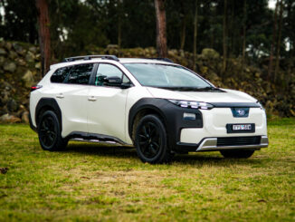 White 2026 Subaru Trailseeker electric SUV, front three-quarter from the driver side, parked on grass