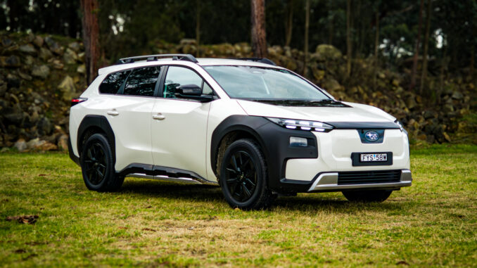 White 2026 Subaru Trailseeker electric SUV, front three-quarter from the driver side, parked on grass