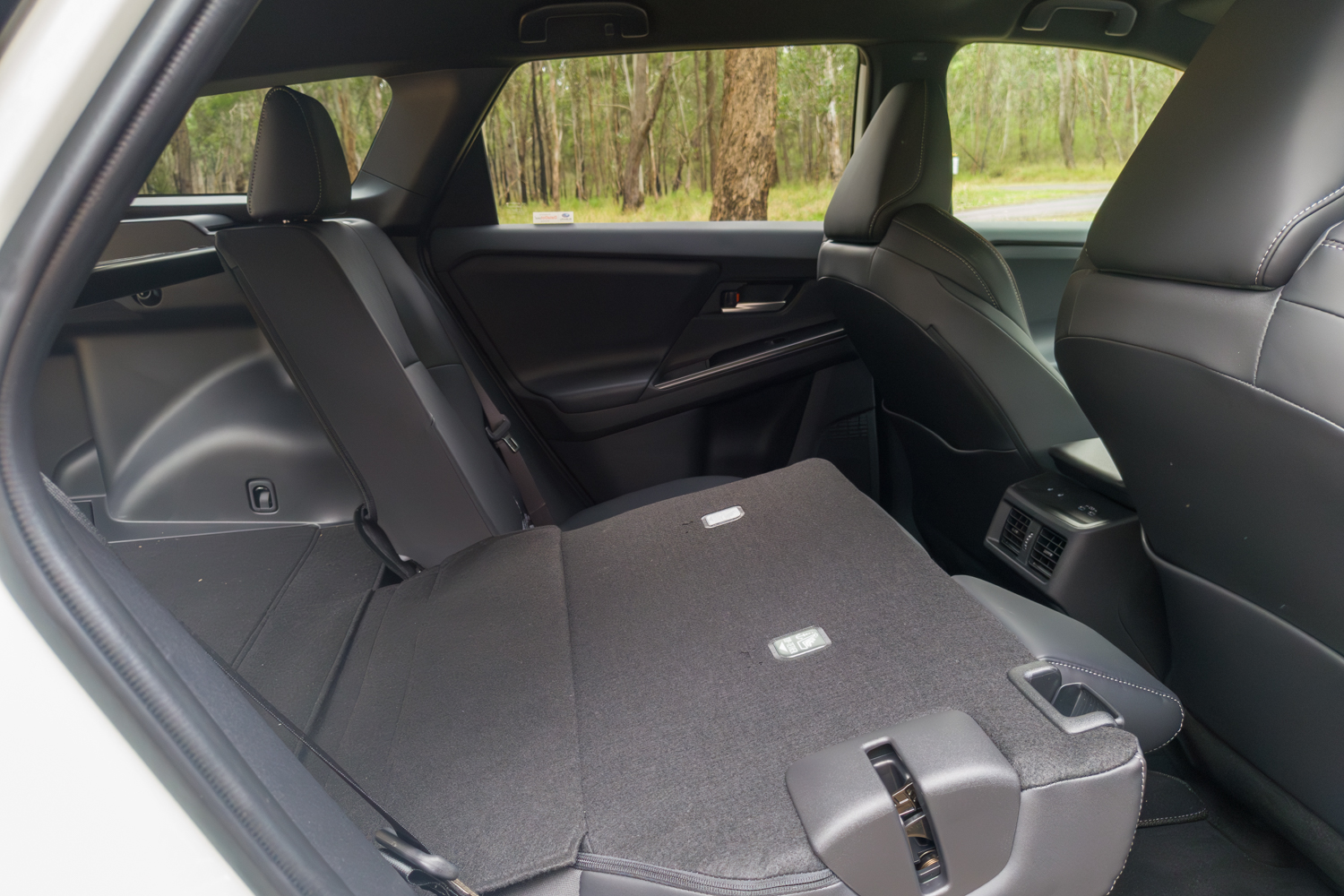2026 Subaru Trailseeker electric SUV, rear seats folded flat from inside the cabin