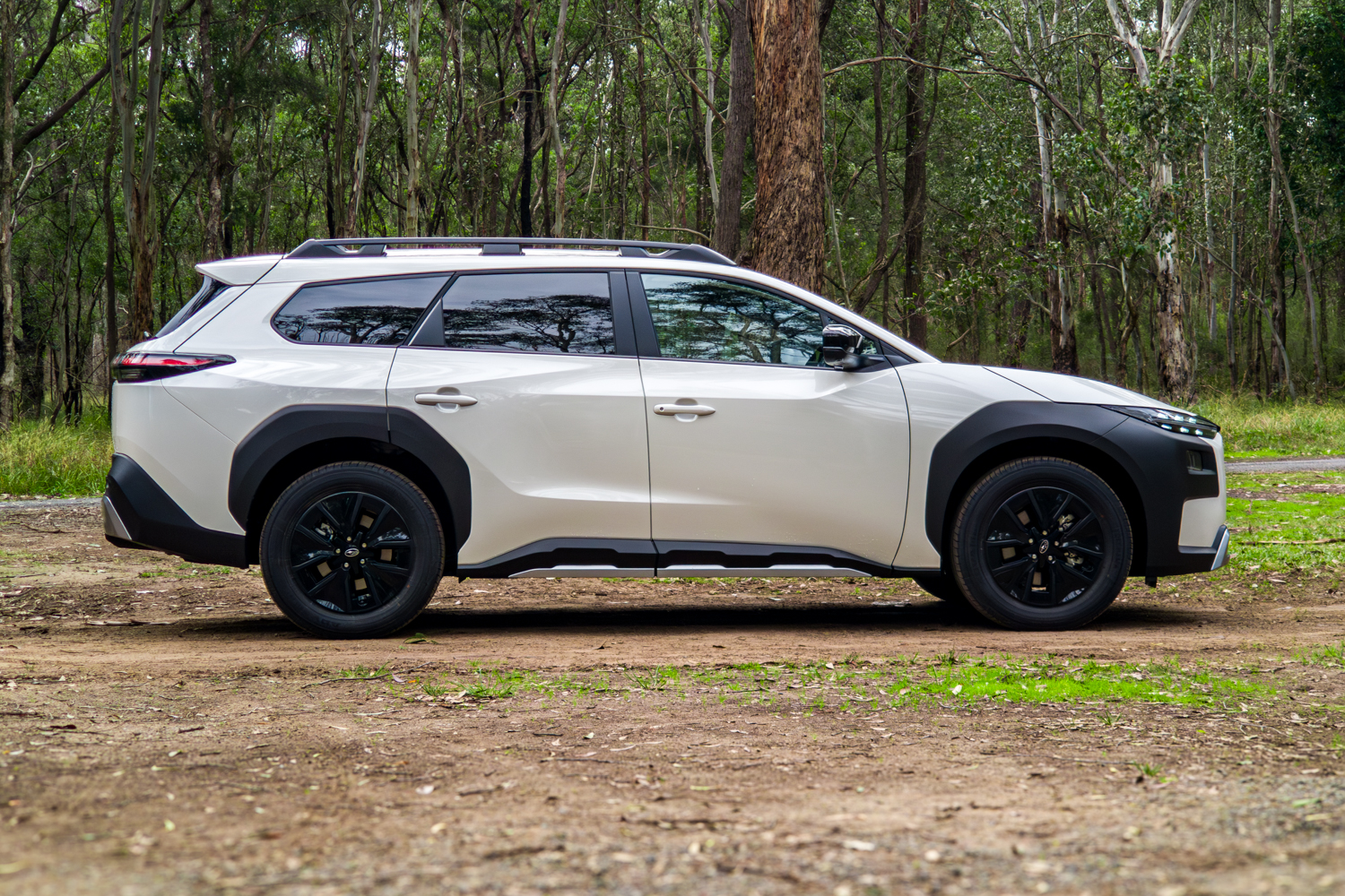 White 2026 Subaru Trailseeker electric SUV, full side profile from the driver side