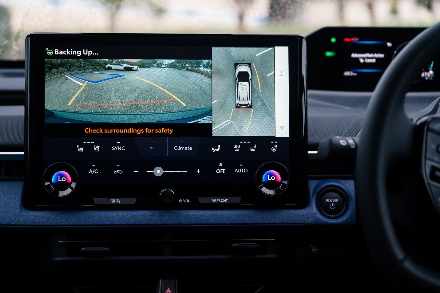 2026 Subaru Trailseeker AWD Touring electric SUV, touchscreen showing reversing and 360-degree camera