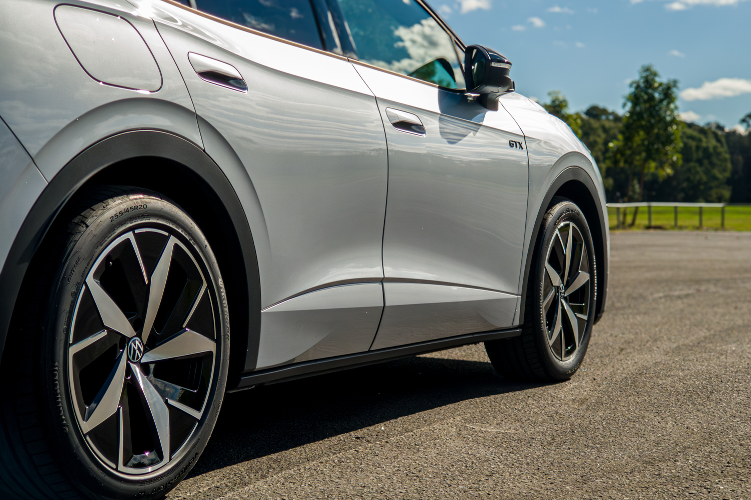 Lower side profile of the silver 2026 Volkswagen ID.4 GTX with GTX badge and alloy wheels
