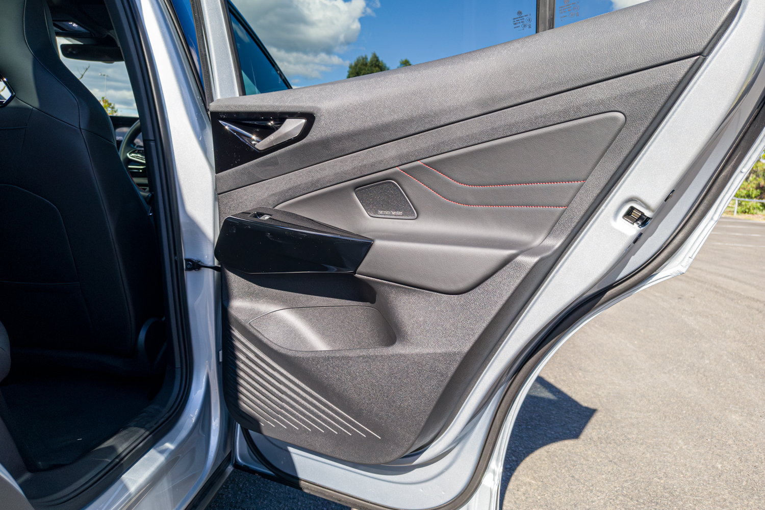 Interior door card with red stitching on the 2026 Volkswagen ID.4 GTX
