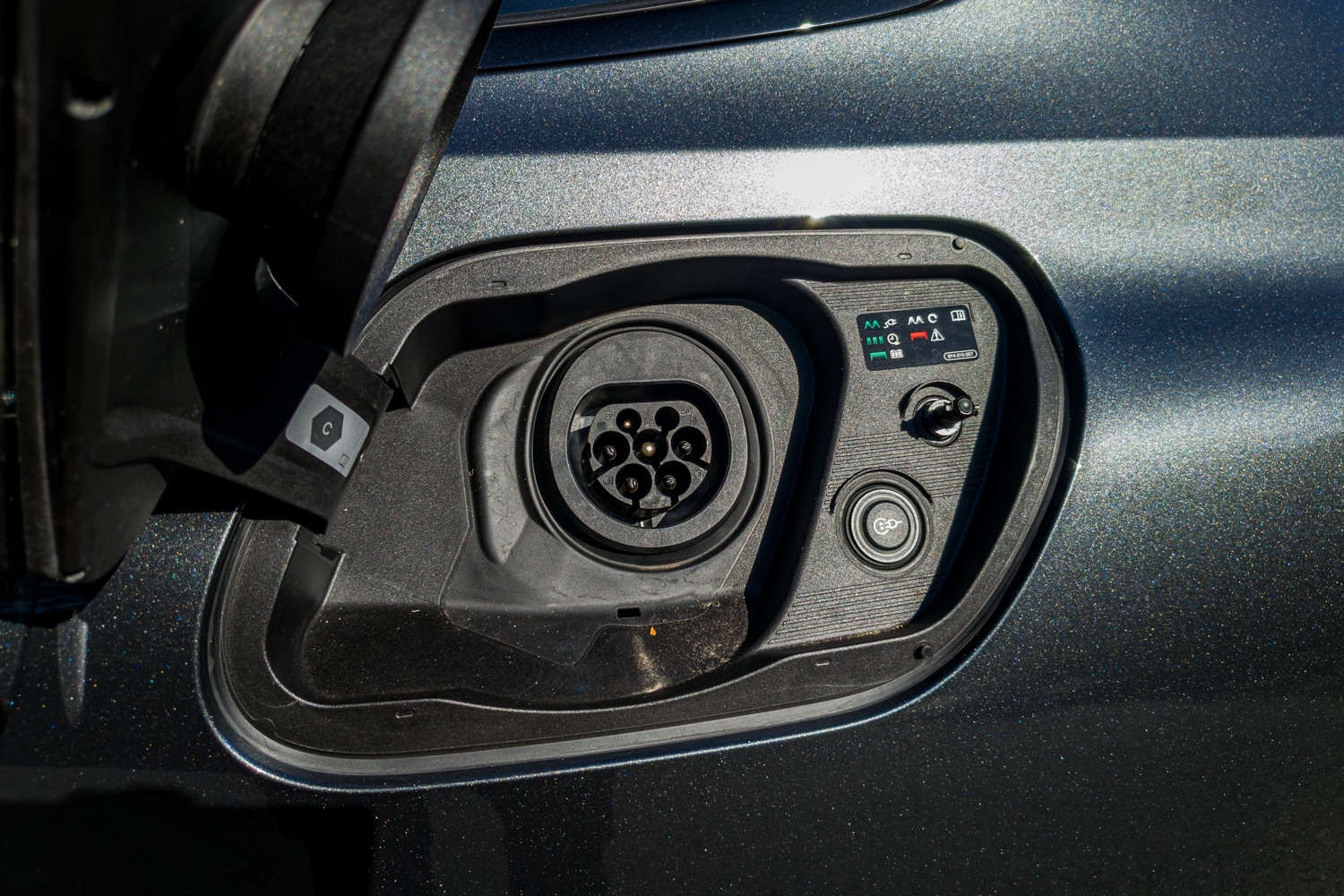 Close-up of the 2026 Audi A5 Sedan e-hybrid quattro Type 2 AC charging port
