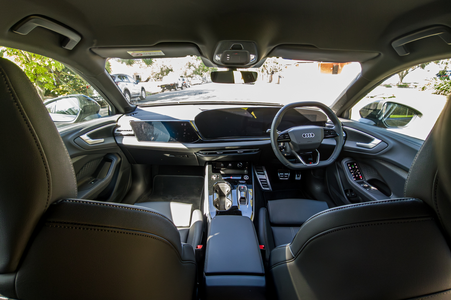 Full interior cabin overview of the 2026 Audi A5 Sedan e-hybrid quattro from rear seats