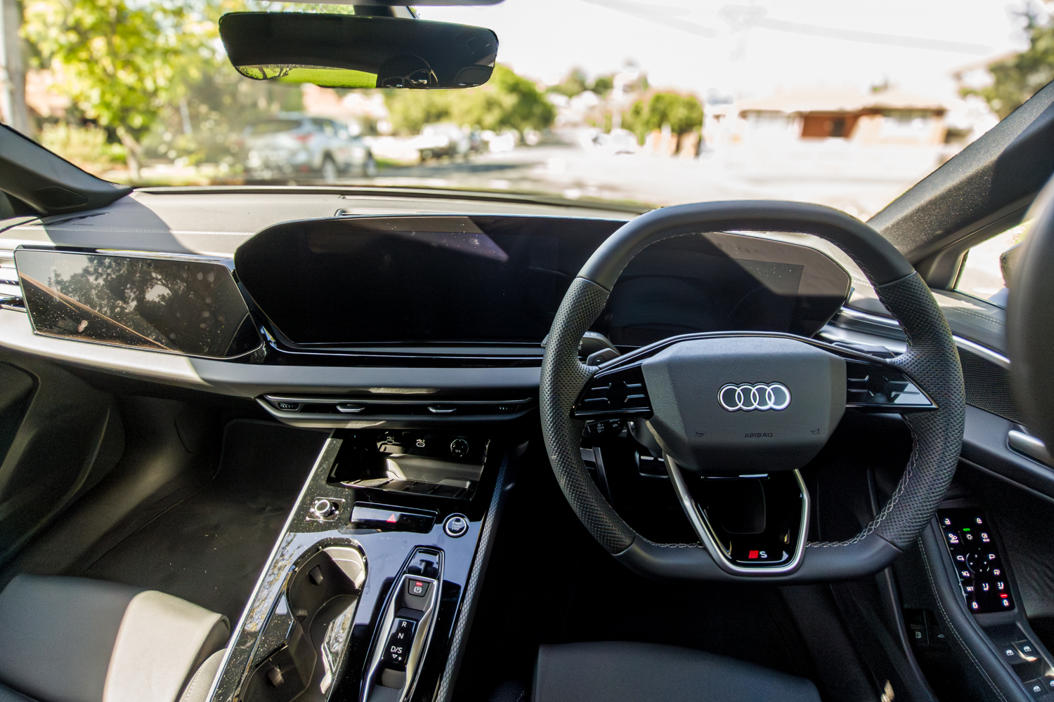 Interior cockpit of the 2026 Audi A5 Sedan e-hybrid quattro showing dual MMI screens and steering wheel
