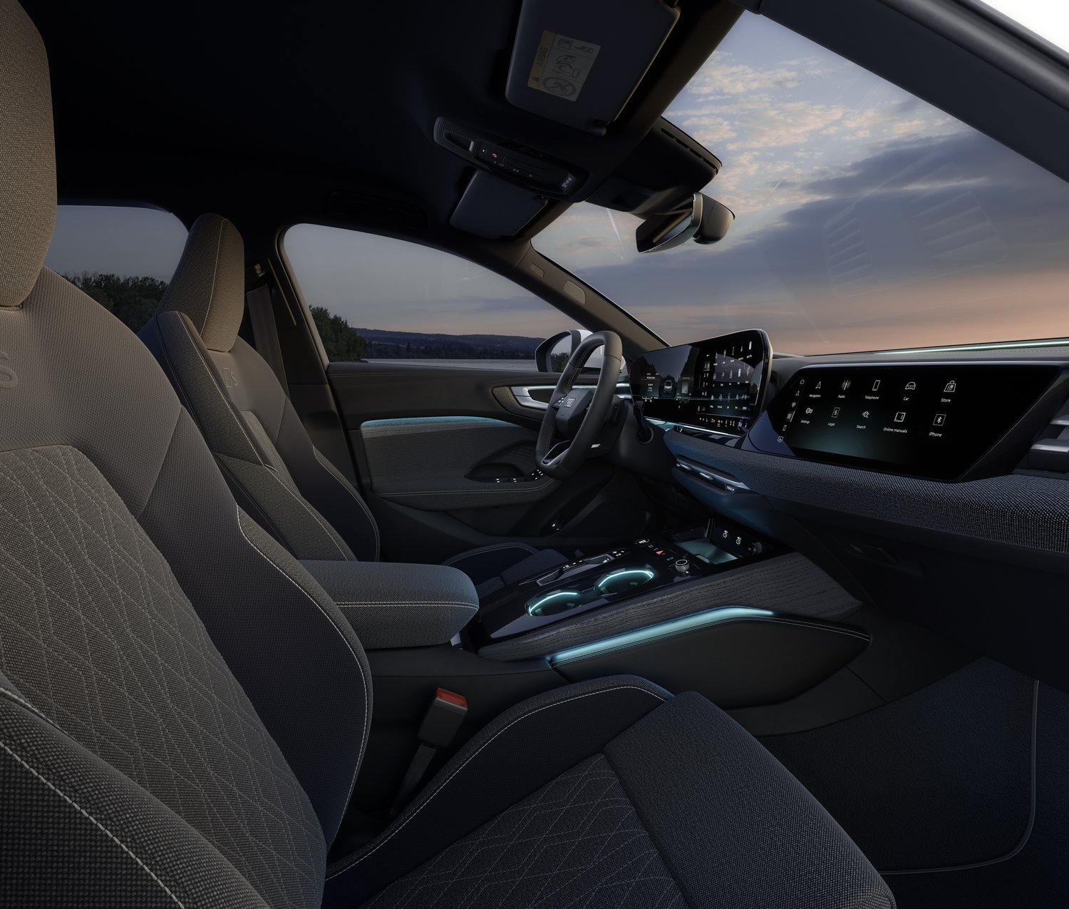 2026 Audi A5 e-hybrid quattro front seats with teal ambient lighting at dusk