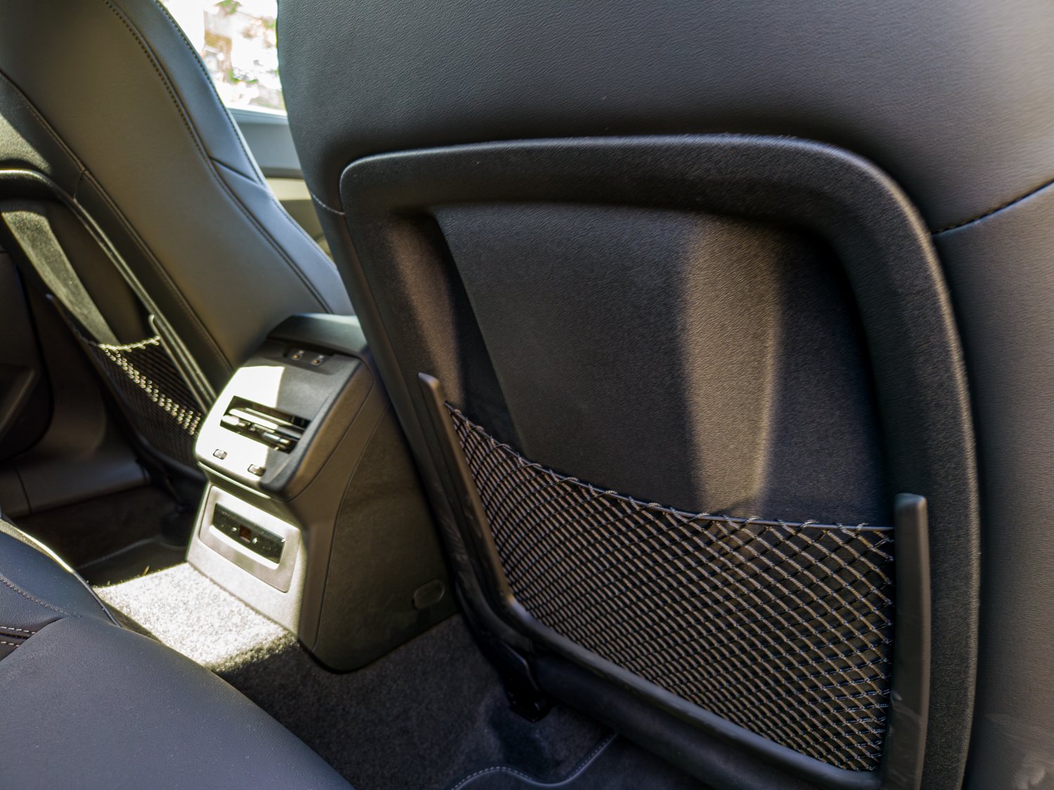 Rear seat-back pocket and climate vents in the 2026 Audi A5 Sedan e-hybrid quattro