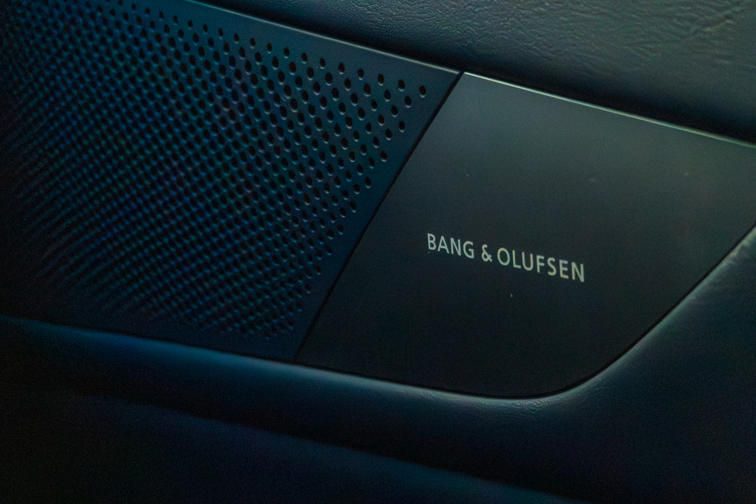 2026 Genesis G80 Electrified Bang and Olufsen speaker badge on interior door panel