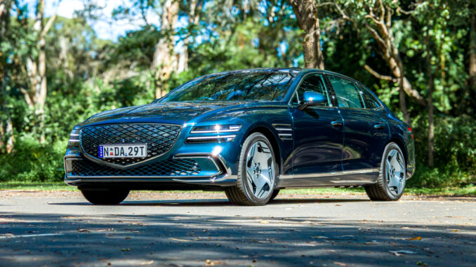 2026 Genesis G80 Electrified Matira Blue front three quarter view from passenger side left