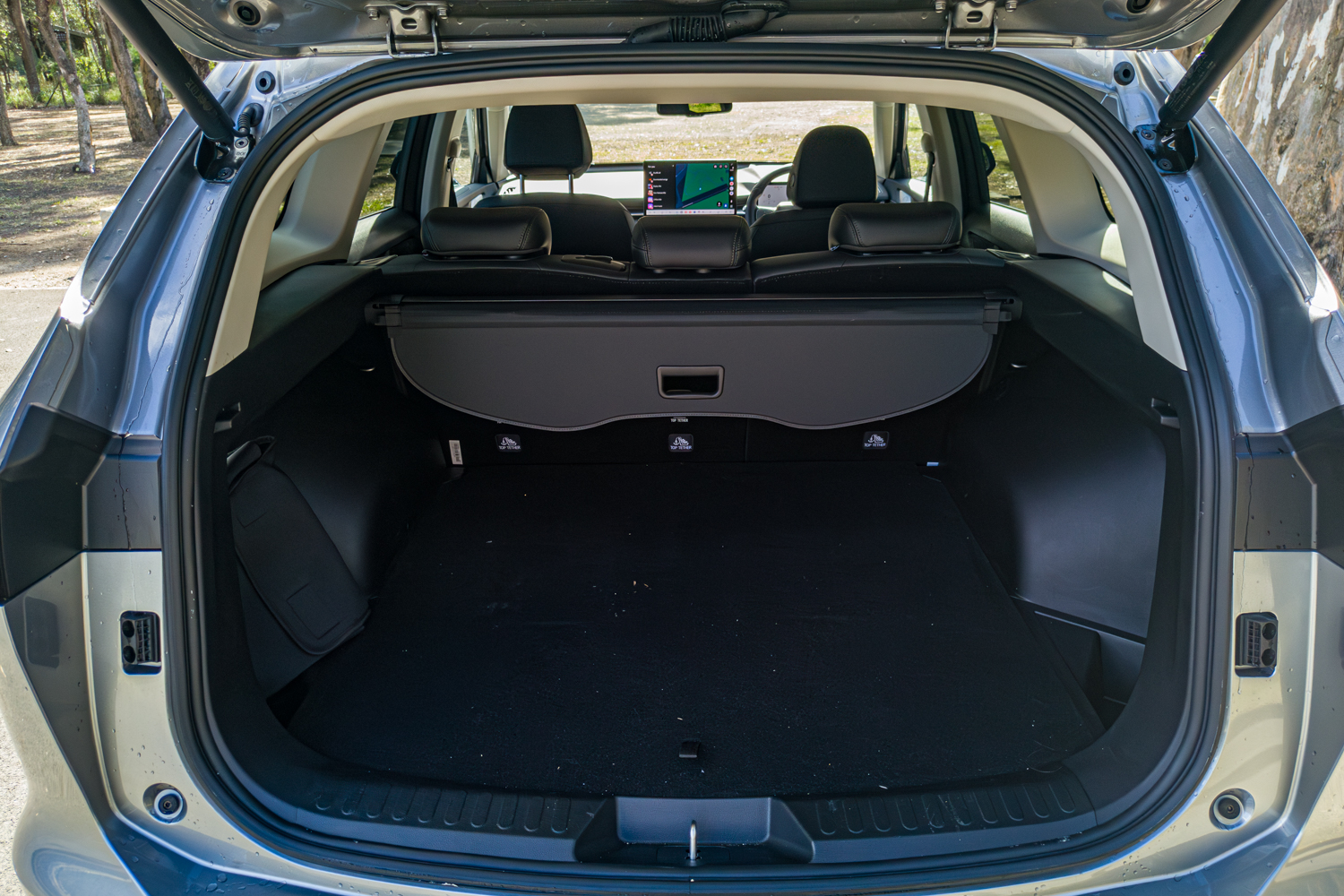 Boot of the 2026 GWM Haval H6 PHEV with the cargo blind fitted and tailgate open