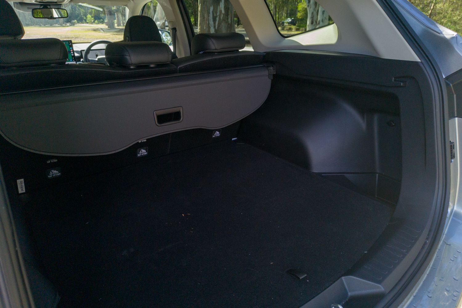 Side angle view into the 2026 GWM Haval H6 PHEV boot showing the cargo area depth