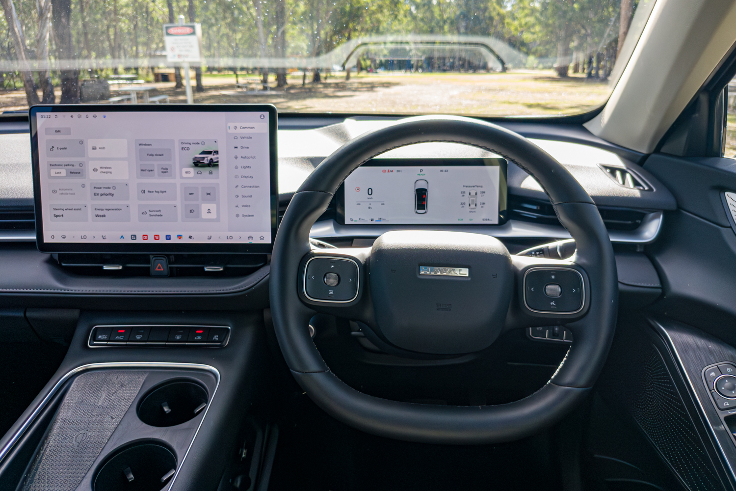Driver view of the 2026 GWM Haval H6 PHEV steering wheel, instrument display and touchscreen