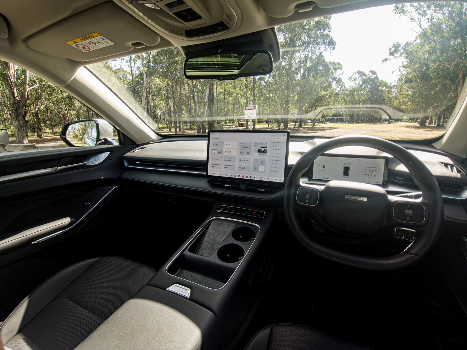 Wide view of the 2026 GWM Haval H6 PHEV dashboard, touchscreen and front cabin