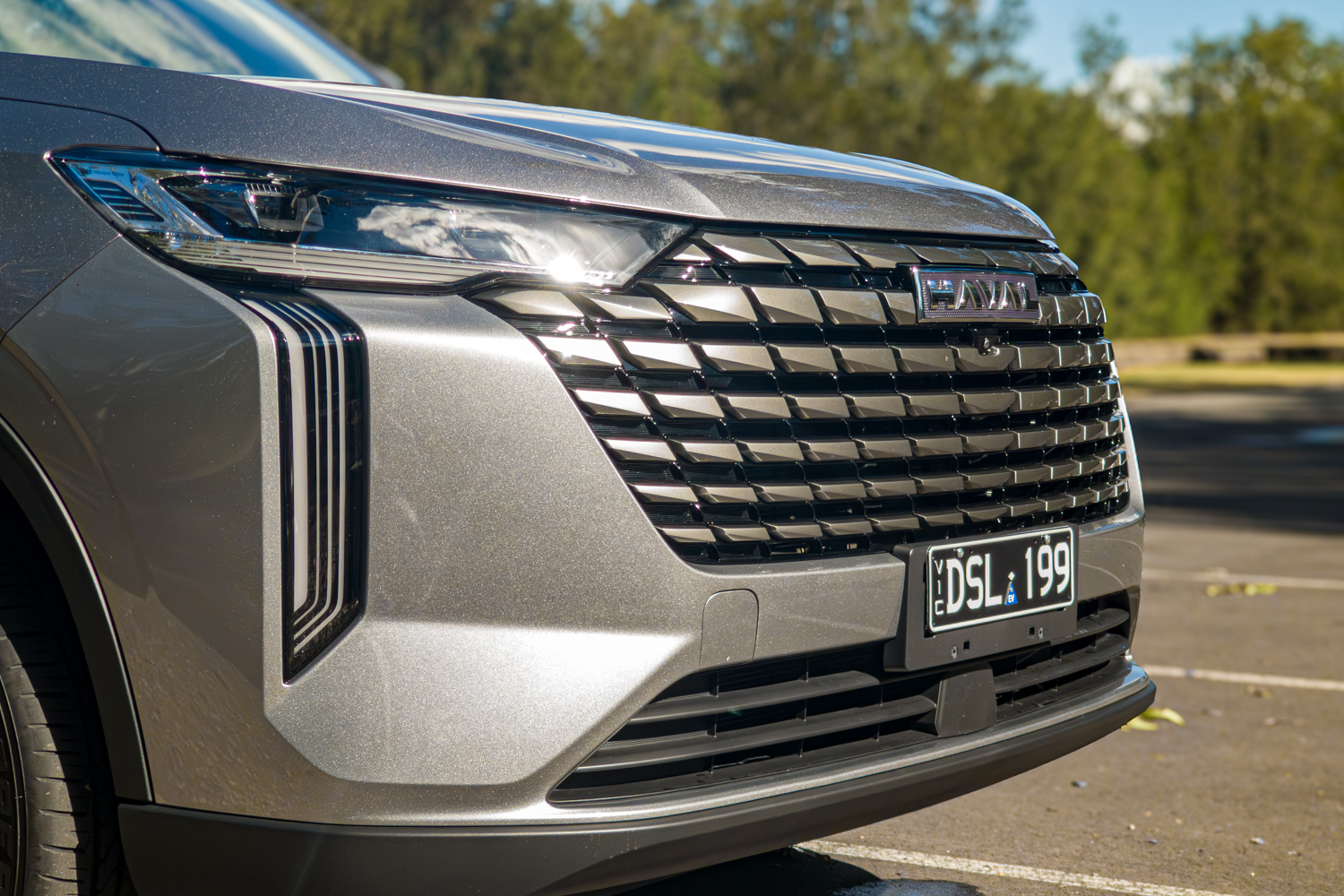 Close up of the 2026 GWM Haval H6 PHEV LED headlight and grille corner