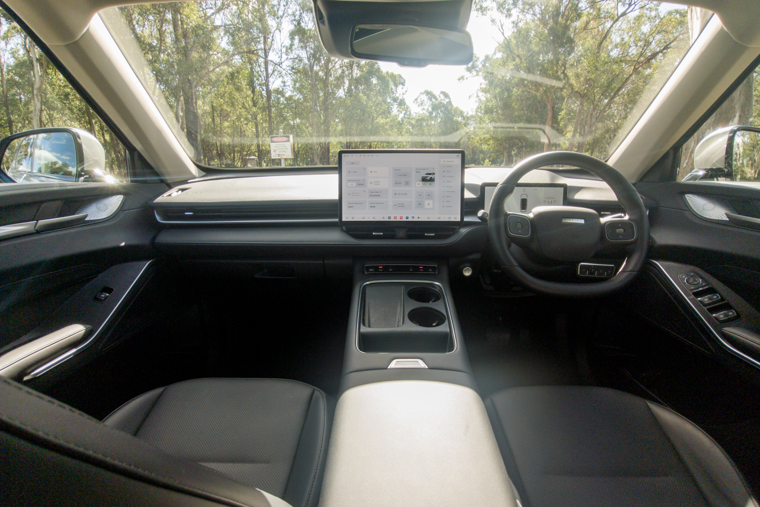 Wide interior view of the 2026 GWM Haval H6 PHEV cabin and dashboard