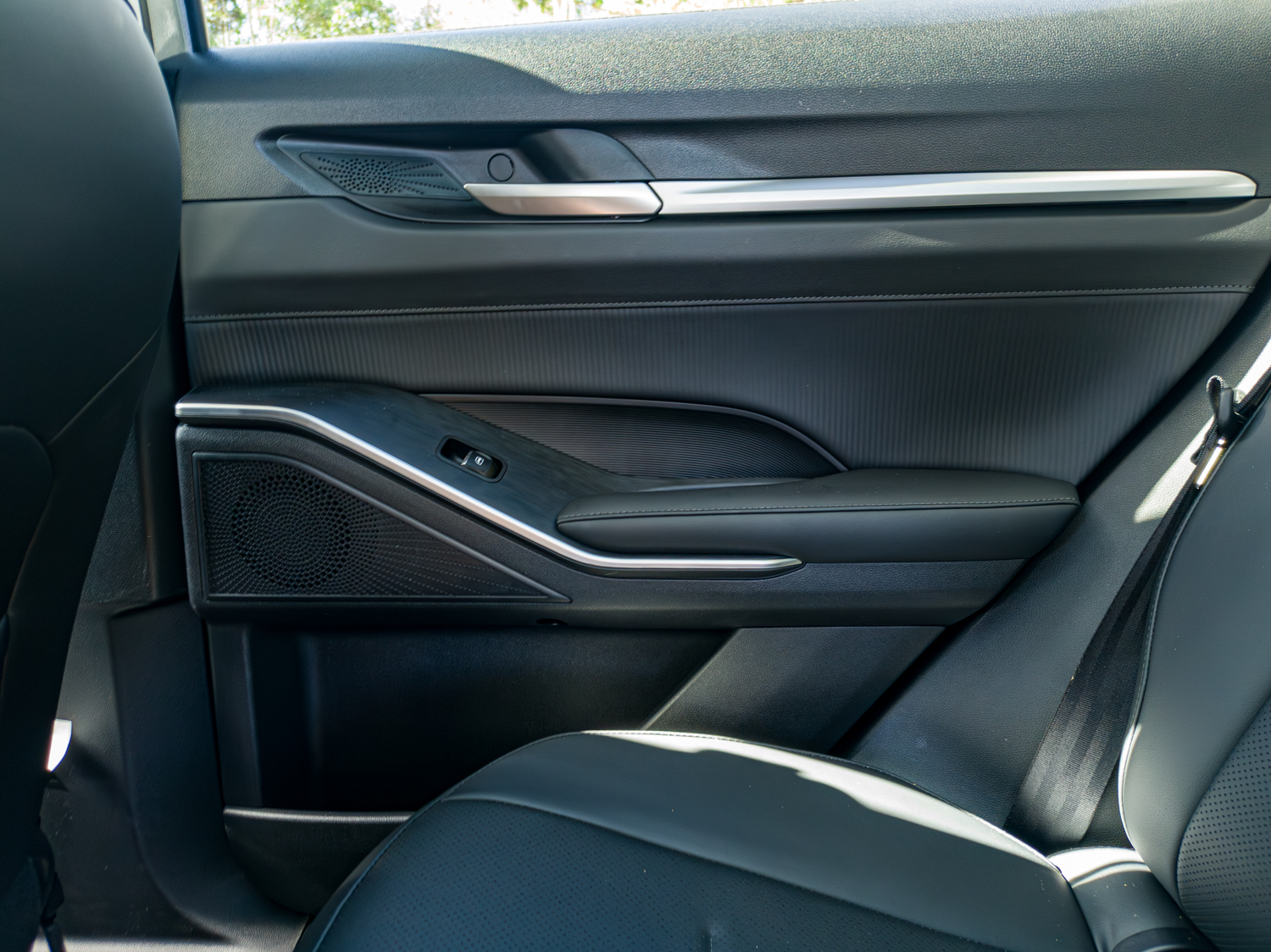 Rear door panel of the 2026 GWM Haval H6 PHEV with speaker and armrest