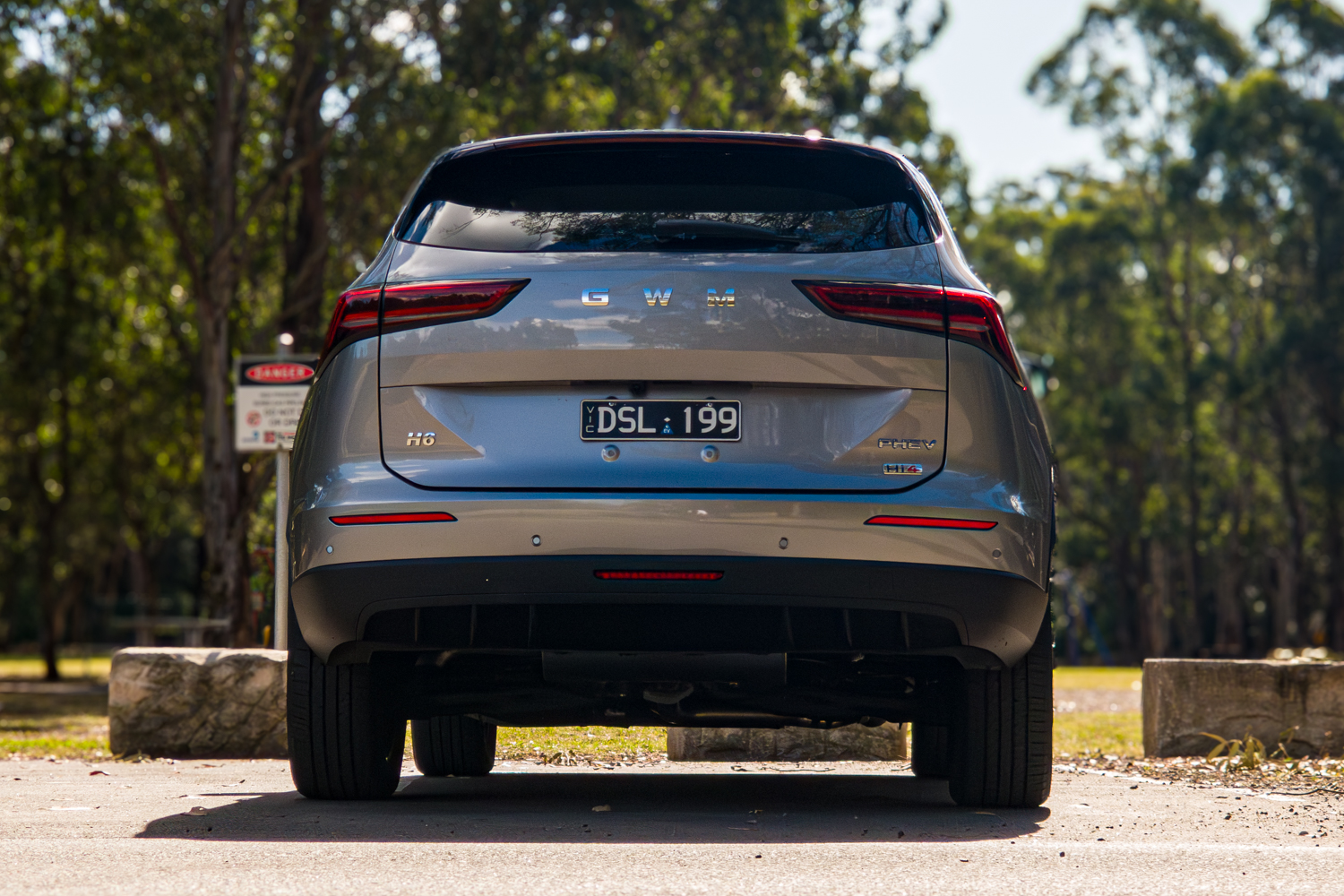 Straight on rear view of the grey 2026 GWM Haval H6 PHEV