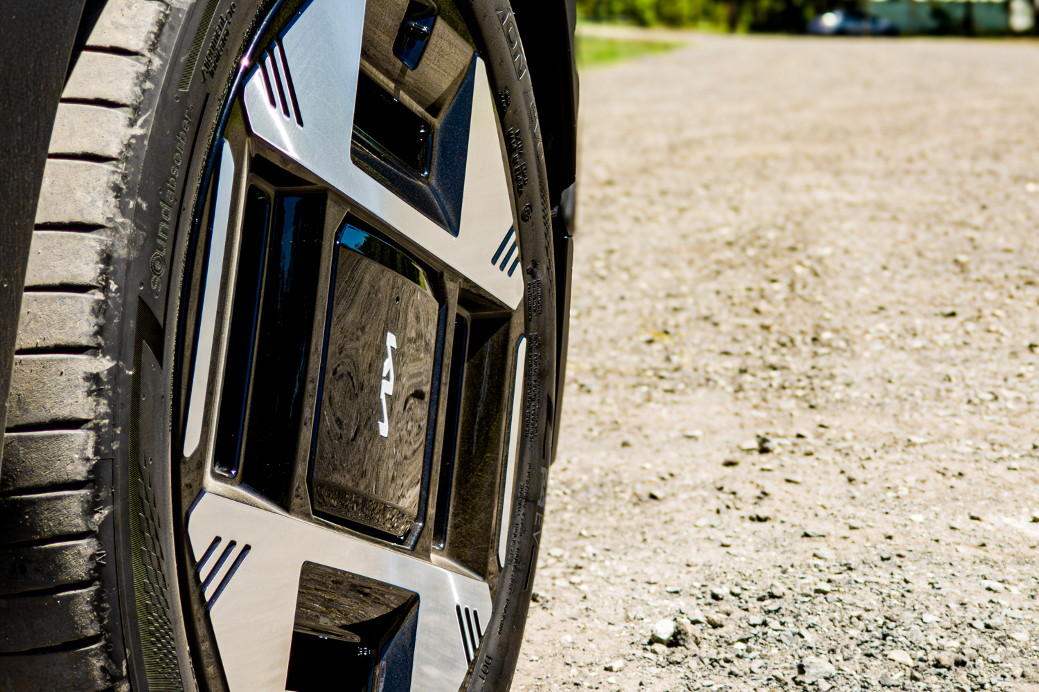 Ground-level close-up of a 19-inch alloy wheel with Kia centre cap on the 2026 Kia EV3 Earth Long Range