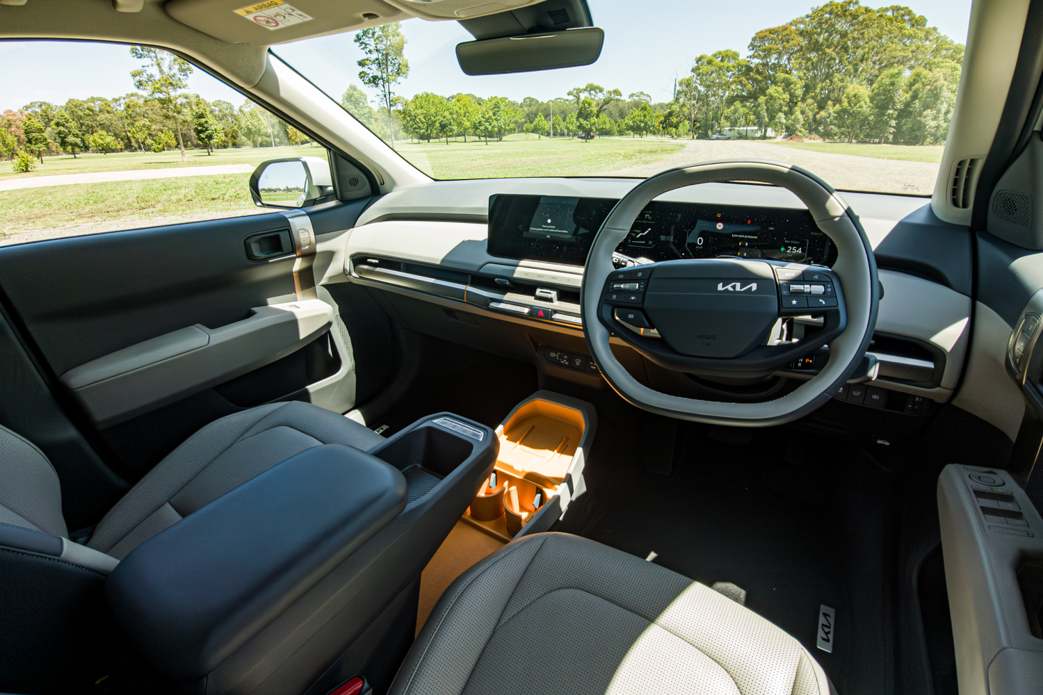 Wide view of the 2026 Kia EV3 Earth Long Range dashboard and front cockpit