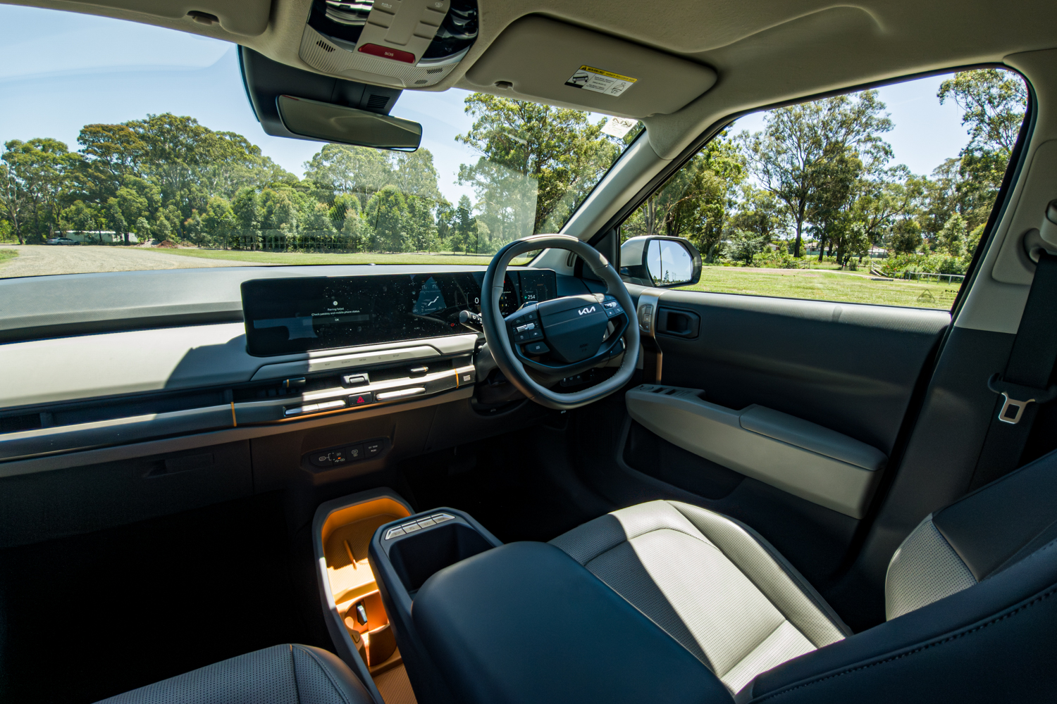 Driver's view of the 2026 Kia EV3 Earth Long Range dashboard with dual 12.3-inch screens