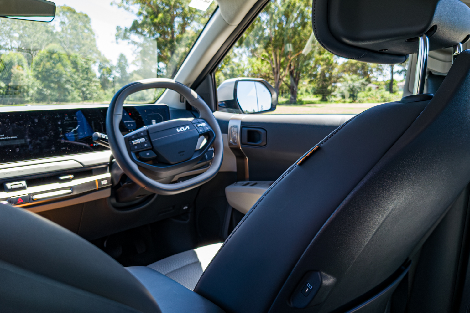 Front seat, B-pillar and driver's area detail in the 2026 Kia EV3 Earth Long Range