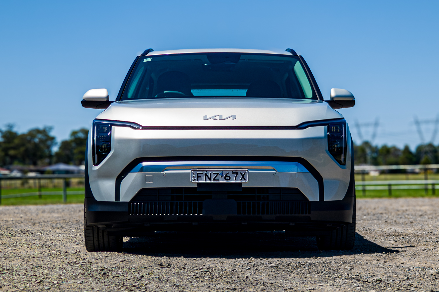 Straight-on front view of the silver 2026 Kia EV3 Earth Long Range electric SUV