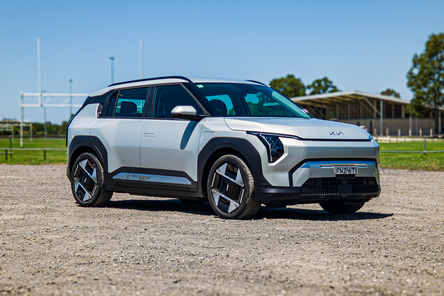 Eye-level front three-quarter view of the silver 2026 Kia EV3 Earth Long Range electric SUV