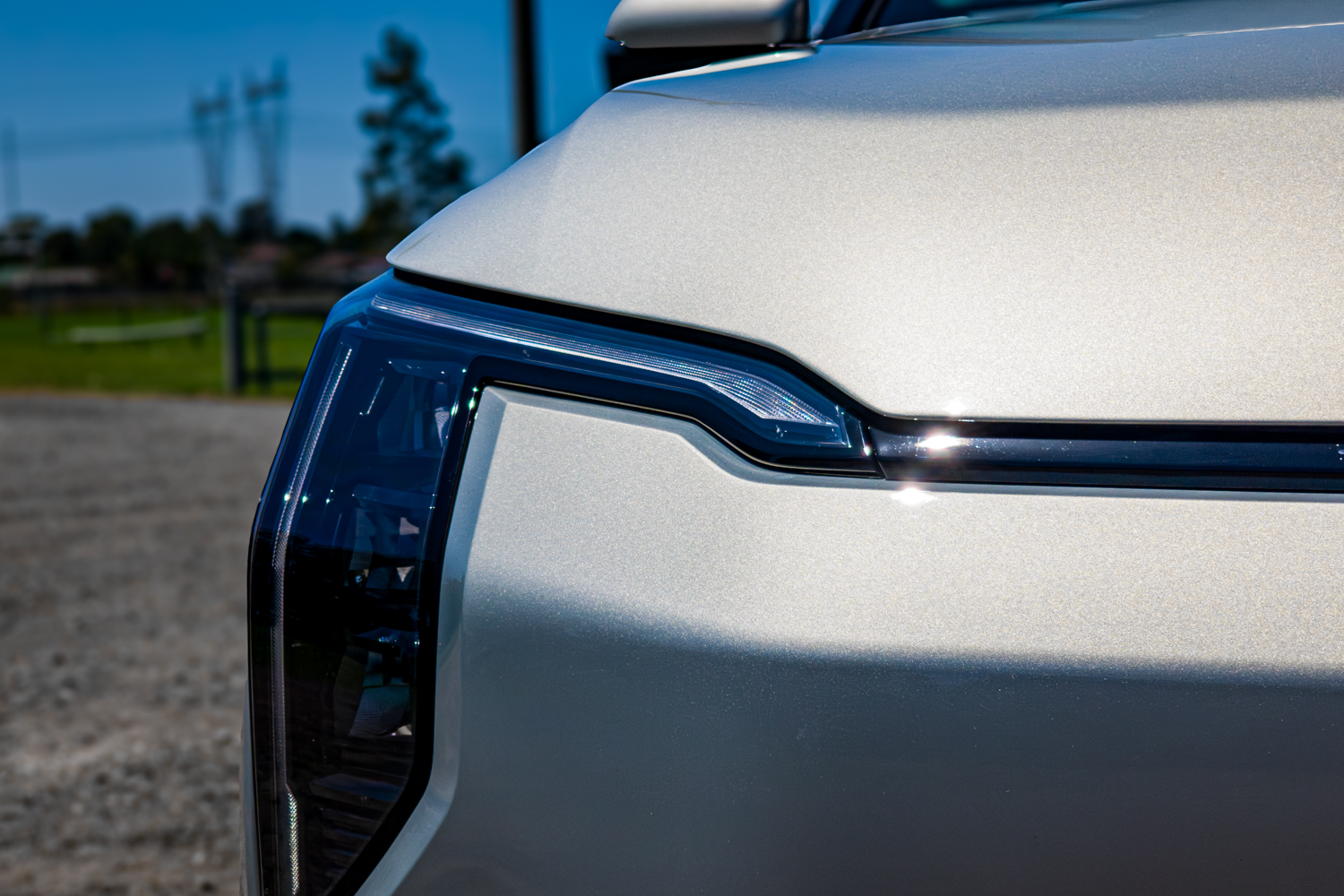 Close-up of the LED headlight and Star Map daytime running light on the 2026 Kia EV3 Earth Long Range