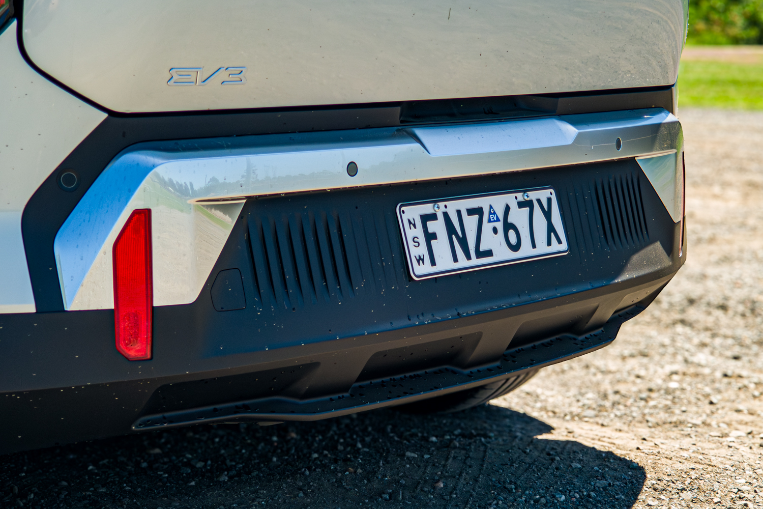 Close-up of the EV3 badge and rear bumper on the 2026 Kia EV3 Earth Long Range with NSW number plate
